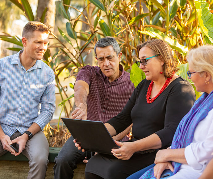 Group of business people having an outdoor meeting in a park