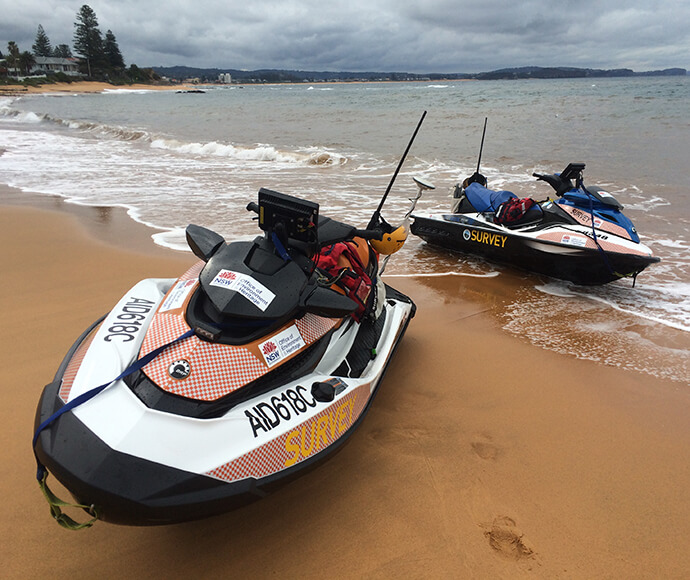 Jet-skis mounted with high-tech echosounder and GPS equipment for hydrographic surveys at Narrabeen Beach, Sydney.