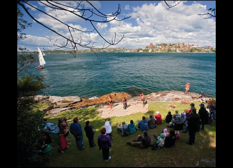 People enjoying an Aboriginal cultural experience, Sydney Harbour National Park.