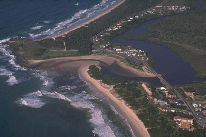 A view of Cudgera Creek surrounded by the town of Hastings Point and Maggies Beach in the foreground