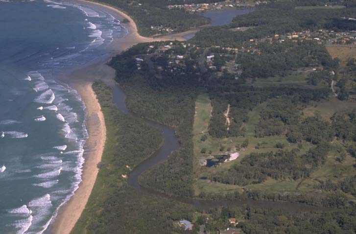 A view of Darkum Creek meeting the sea beside Darkum Beach