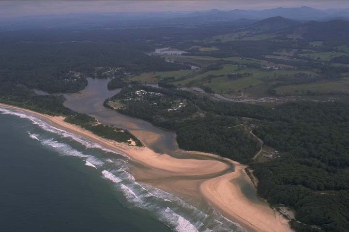 A view of Deep Creek meeting the sea with South Valla Beach in the foreground