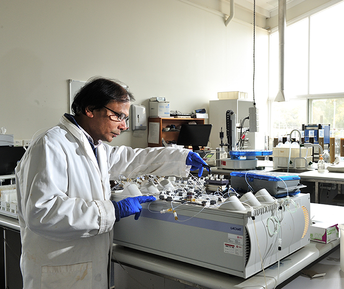 A Flow Injection Analysis instrument being used by a technician used to test for Nutrients in soil and sea water at the Soil Health and Archive laboratory located at Yanco NSW.