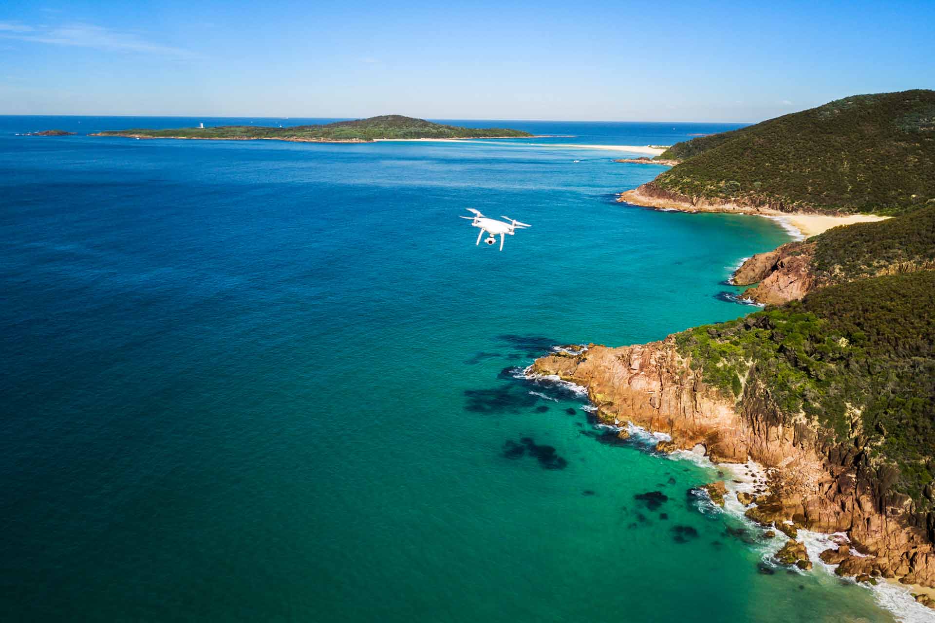 Drone flying over the ocean near Tomaree National Park