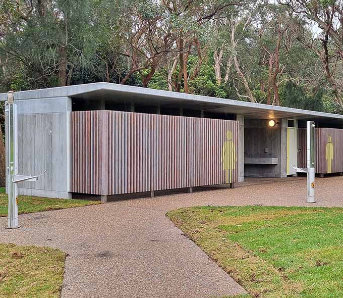 Image shows the new toilet amenities at Kamay Botany Bay National Park's Commemoration Flat. The amenities include modern facilities that blend into the natural surroundings, providing convenience while preserving the park’s beauty. The space is clean, well-maintained, and ready for visitors to enjoy.