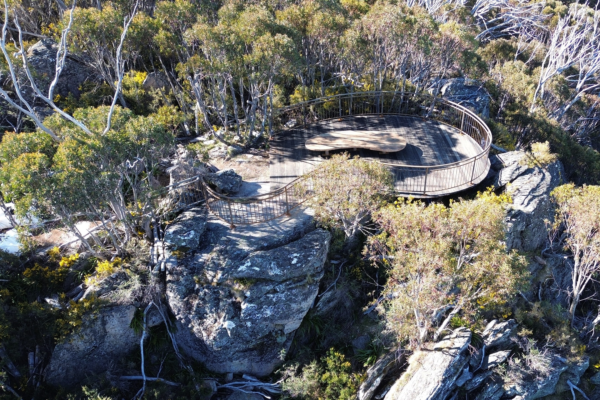 A curved lookout surrounded by boulder