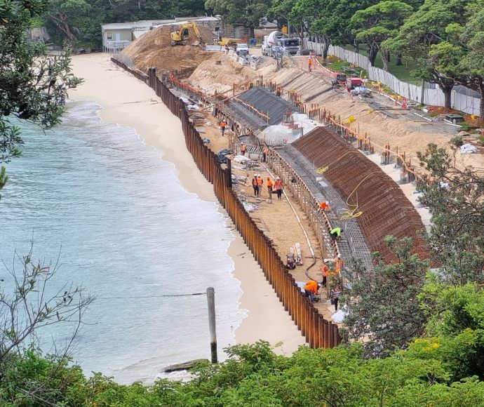 Aerial view of the first bleacher concrete pour, Nielsen Park, , Sydney Harbour National Park, showing workers and machinery involved in the rebuilding process along the shoreline.