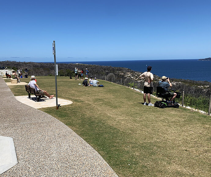 Visitors at North Head in Sydney Harbour National Park, enjoying scenic views of the harbour and surrounding natural landscape.